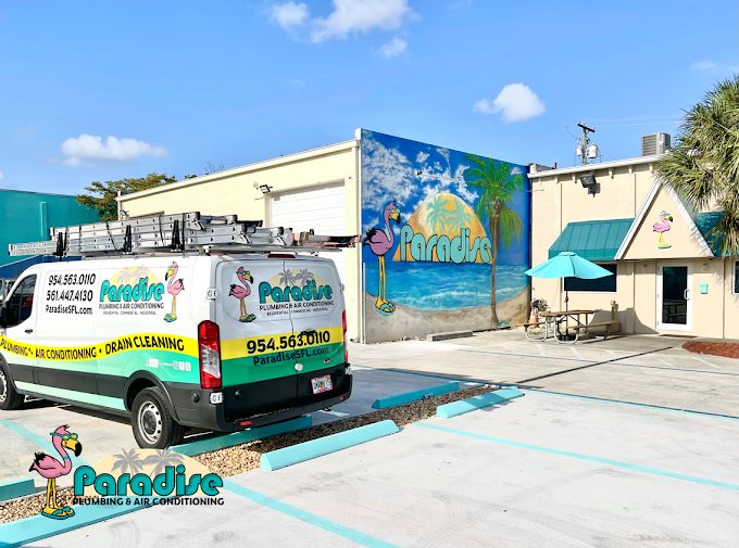 260 SW 21st Terrace today: renovated office with Paradise beach mural, service van and teal awnings