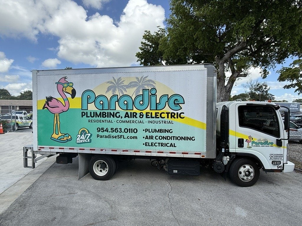 Paradise Plumbing, Air & Electric install box truck with flamingo wrap